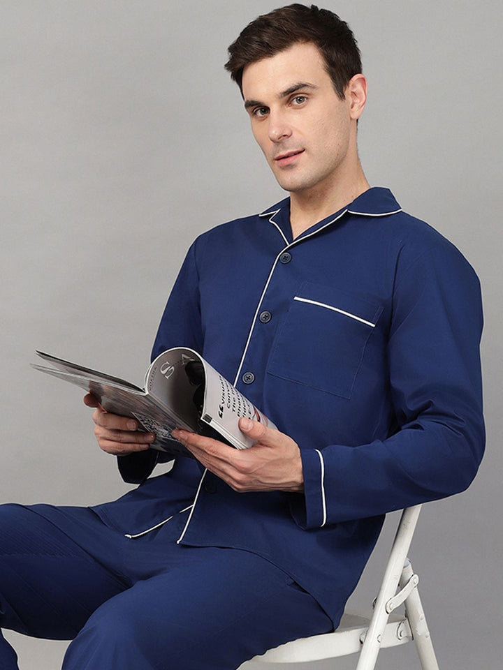 Royal Blue solid stretchable wrinkle ressistant lapel collar casual nightsuit, has 1 patch pocket and long sleeves. Trousers with 2 pockets, slip on waist and drawstring.